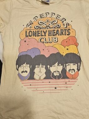 Junk Food Clothing Beige Tee with Orange and Black Retro Graphic
